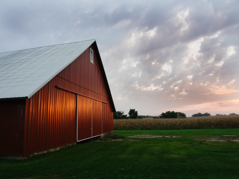 A red barn at sunset